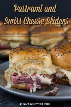 two sandwiches on a plate with the words, pastrami and swiss cheese sliders