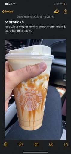 someone is holding up a starbucks cup with caramel sauce on it and the coffee has been iced