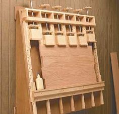 a wooden art easel with lots of tools on it