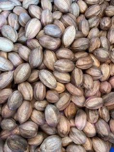 a pile of nuts sitting next to each other on top of a blue table cloth