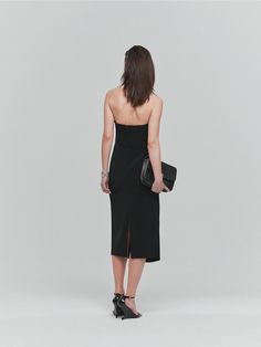 This is L’H.A.S’s sleek, midi-length slim-fit dress with a sophisticated look. The simple design features an impressive bustier-style neckline with silicone tape detail inside the chest line to prevent slipping, and wire detail connecting from the waist to the chest line delicately shapes the silhouette securely at the waistline. It falls straight down to the hemline, forming an H silhouette. It can be worn solo for special occasions or styled sensibly with jackets, round neck jackets, basic shirts, etc.- It's an ideal item for wearing on special occasions- Can be paired with various styles of accessories or outerwear to create different looks- There is a slit at the back hem for comfortable movement Silicone Tape, Slim Fit Dresses, Fit Dress, Basic Shirts, Midi Length, Simple Design, Dress Black, Simple Designs, Design Features