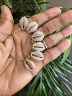 Handmade.. fits most ear.. bendable to fit properly for 1 ear ONLY Unique Adjustable Hoop Earrings For The Beach, Handmade Shell Hoop Earrings For Beach, Cowrie Shell Earrings For Gifts, Fulani Earrings, Cowrie Shell Necklace, Cowry Shell, Fancy Jewellery Designs, Cowrie Shells, Wrap Earrings