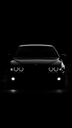 a car is shown in the dark with its headlights turned on and it's headlight up