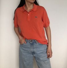 Vintage Lacoste polo T-shirt Length 68 cm Width armpit to armpit 54 cm Arm length from the collar 36 cm My height is 169 cm.  Thanks for interest in this item. Please have a look at other unique vintage pieces in my shop. Orange Polo Outfit Woman, Casual Orange Collared T-shirt, Vintage Polo Outfit Women, Orange Collared Cotton Polo Shirt, Orange Cotton Collared Polo Shirt, Summer Orange Polo Shirt With Polo Collar, Orange Polo Shirt With Polo Collar For Summer, Orange Polo Shirt With Collar For Summer, Summer Orange Polo Shirt With Collar