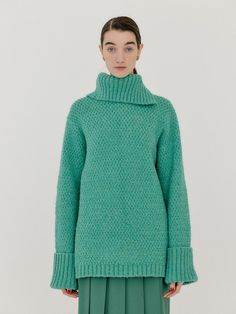 This is a luxurious, bright green knitwear. The oversized and dropped shoulders make it comfortable to wear, and the turtleneck keeps you warm. - Features a unique texture- The length is long and is good for matching with various bottoms.- Rolled-up design at the end of the sleeves*Colors may look different depending on monitor specifications. Oversized Textured Knit Turtleneck With Funnel Neck, Green Funnel Neck Sweater For Fall, Green Funnel Neck Winter Sweater, Green Funnel Neck Sweater For Winter, Green High Neck Knit Sweater, Green Textured Knit Turtleneck Sweater, Green Textured Turtleneck Sweater, Green Cable Knit Turtleneck Sweater, Oversized Green Turtleneck Sweater