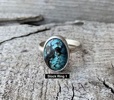 A unique oval turquoise cabochon has been set in sterling silver with a handmade ring band from sterling silver half dome wire. Each turquoise stone will be unique, but all are a lovely blue or green turquoise color with black or brown veins or spots running throughout. These turquoise stones are 100% natural. The turquoise stone is 14mmx 10mm in size with a height of 6mm. The ring band width is 3mm. This listing is for 1 ring only. Made to order! Choose your turquoise stone from the second to l Untreated Adjustable Oval Turquoise Ring, Artisan Oval Turquoise Ring In Sterling Silver, Bohemian Silver Turquoise Ring With Oval Shape, Adjustable Oval Turquoise Ring In Sterling Silver, Adjustable Oval Sterling Silver Turquoise Ring, Adjustable Turquoise Oval Cabochon Ring, Adjustable Sterling Silver Turquoise Ring With Oval Cabochon, Handmade Silver Turquoise Ring With Oval Cabochon, Oval Turquoise Chrysocolla Ring In Silver