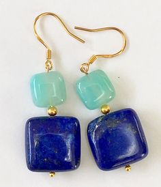 Rich blue squares of lapis lazuli are topped with gold plated silver beads and smaller squares of very pretty aqua blue agate. They dangle from gold plated 925 silver hooks and the drop length is 2 inches. Agate Earrings, Clover Necklace, Green Quartz, Blue Square, Blue Agate, Labradorite Pendant, Quartz Earrings, Bead Jewellery, Gorgeous Necklaces