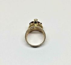 Vintage 14k Yellow Gold Wide Filigree Oval Garnet & Round Pearl Ring Size 6.5 Metal: 14k yellow gold, stamped Weight: 6.6 grams Ring size: 6 1/2 (can be resized upon request) Width: 17mm wide (at widest points) Stones: Center round pearl aprx. 2.60mm, 6 oval garnet stones aprx. 5mm x 3mm Hallmarked: 14k This is an estate piece in very good condition. Please see pictures for reference. Antique Gold Oval Filigree Ring, Ornate Gold Oval Filigree Ring, Gold Oval Filigree Collectible Ring, Gold Filigree Ring With Gemstone For Formal Occasions, Oval Yellow Gold Filigree Ring Stamped 14k, Gold Oval Gemstone Filigree Ring, Ornate Yellow Gold Oval Filigree Ring, Garnet Stone, Multi Stone Ring