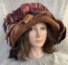 A little crazy and wild . Just for fun . Wet felted flapper hat . Size 22,5-24 inches . if you have a smaller head size, please message me so I can size it for you . Mannequin head size is 21, hat looks smaller on larger heads . Thanks. Handmade Brown Cloche Hat With Wide Brim, Bohemian Wool Felt Hat For Fall, Handmade Wool Brown Hats, Whimsical Brown Hat With Curved Brim, Brown Mini Hat With Short Brim For Fall, Handmade Brown Wool Hat, Brown Mini Hat With Curved Brim For Fall, Brown Mini Hats With Curved Brim For Fall, Brown Short Brim Mini Hat For Fall