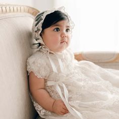 Handmade in the USA This girls Baptism gown is so gorgeous and so detailed, it's not a stretch to say that it is truly a work of art. The lace overlay on this baptism gown is both stunning and special, made of embroidered netting with a rich floral design featuring embroidered flowers in a pretty shade of ivory with champagne cording, adding depth and richness. Trimmed in ivory Venice edging and long ivory silk ribbon bows flowing down the skirt. Includes the matching sheer lace bonnet. This bea Elegant Baptism Dress With Fitted Bodice And Lace, Fitted Lace Work First Communion Dress For Wedding, Elegant Gown With Lace Sleeves For First Communion, Fitted Lace First Communion Dress, Ceremony Baptism Dress With Lace Trim And Fitted Bodice, Elegant Lace Gown For First Communion, Fitted Baptism Dress With Lace Bodice, Elegant Fitted Baptism Dress For Church, Lace Baptism Dress With Fitted Lace Bodice