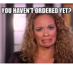 a woman with curly hair and an expression on her face that says, you haven't ordered yet?