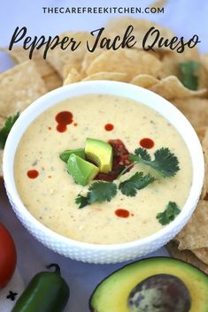 a bowl of quesadilla dip surrounded by tortilla chips and avocado