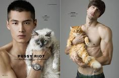 a man holding a cat and posing for a photo shoot with his shirtless body