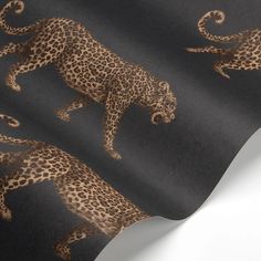 a black and brown wallpaper with leopards on it