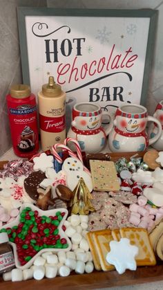 an assortment of hot chocolates, marshmallows, and other holiday treats