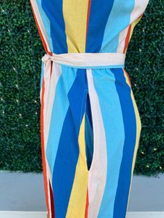 Get ready to turn heads this summer with our Summer Stripes Maxi Dress! The stunning vertical stripes in blue, yellow, and orange will elongate your figure while adding a playful touch. Plus, with pockets, a button-up design, and a flattering belted waist, you'll look and feel effortlessly chic. Maximize your summer style with this must-have dress. Trendy Dresses Summer, Striped Shirt Dress, Summer Stripes, Maxi Shirt Dress, Striped Maxi, Striped Maxi Dresses, Tres Chic, Vertical Stripes, Summer Style