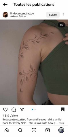 the back of a woman's arm with tattoos on it and an image of leaves