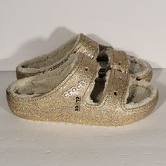 Brand New Without Box Women's Size 6 Casual Flat Glitter Sandals, Casual Gold Synthetic Slides, Casual Glitter Sandals With Synthetic Material, Gold Synthetic Slides With Cushioned Footbed, Casual Glitter Synthetic Sandals, Casual Open Toe Glitter Sandals, Comfortable Gold Synthetic Sandals, Gold Glitter Synthetic Sandals, Lined Crocs