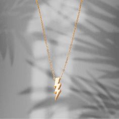 I Bought The Two Necklaces (Gold And Silver) Mainly Because It Reminded Me Of Sandoval’s Famous Necklace Caught In “Scandoval” Drama Of Vanderpump Rules. Regardless, It Is A Very Fashionable, Minimalistic Statement Necklace. Size/Measurements: 40cm Long Chain, Pendant- Width: 1cm, Height: 3cm Color: Gold Material: 18k Gold Plated On Alloy - Condition: Nwt (New With Tags) = Excellent! Minimalist Yellow Gold Charm Necklace With Rectangular Pendant, Lightning Jewelry, Gold Lightning Bolt Jewelry Gift, Lightening Bolt Necklace Gold, Lightning Bolt Necklace, Stone Statement Necklace, Wooden Necklace, Necklace Box, Faux Pearl Necklace