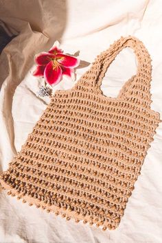 Vanya is not your typical beach style tote bag. Handwoven from natural cotton thread, and finished with wooden beads, she is one of our top picks this season. This bag is fantastic and can fit far more than you expect, and all handmade with love! Summer Vacation Beaded Beach Bag, Summer Beaded Crochet Bag For Daily Use, Bohemian Beaded Crochet Bag For Summer, Bohemian Beaded Beach Bag For Summer, Summer Beach Beaded Straw Bag, Summer Vacation Beaded Straw Bag, Summer Beach Crochet Bag With Beaded Detail, Beaded Crochet Beach Bag For Summer, Summer Beach Crochet Bag With Beads