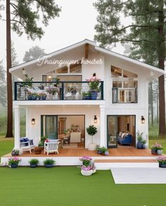 a small white house with two balconies on the top floor and balcony above it