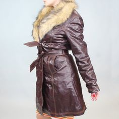 Vintage 90s Leather and faux fur coat! by Maxima from Wilson's. Burgundy/oxblood leather mid length coat with fluffy faux fur trim around the collar. Button and belt closure! Size LBust: 41"Waist: 34"Hips: 42"Length: 36 3/4" Brown Fitted Long Fur Coat, Fitted Belted Fur Coat For Fall, Fitted Brown Leather Jacket With Faux Fur Trim, Fitted Leather Fur Coat With Faux Fur Lining, Burgundy Fur Coat, Mid Length Coat, Leather Coat Womens, Oxblood Leather, Faux Fur Coat