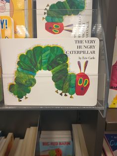 the very hungry caterpillar book is on display in a store shelf with other children's books