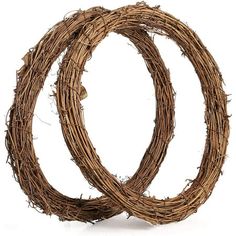 two wreaths made out of twigs on a white background