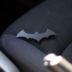 the batman symbol is on the seat of a car