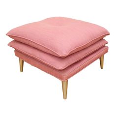 three pink cushions stacked on top of each other