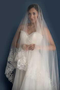 a woman in a wedding dress and veil