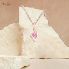 Description In a sound pressure setting, a gleaming round Pink Sapphire is linked to a twisted design. The beautiful style of this Pink Sapphire solitaire pendant attracts all attention to its bright pinkish color. It is made of 14k solid gold. The gold chain shown in pictures is just for reference and display purpose, in order pendant comes with a COMPLIMENTARY 925 SILVER CHAIN. Product Details SKU CJ-P-1408-PS Metal 14K Solid Gold Product dimension 18.65mm x 7.60mm Birthstone September STONE D Elegant Pink Pendant Birthstone Necklace, Fine Jewelry Rose Gold Birthstone Necklace With Round Pendant, Rose Gold Round Pendant Birthstone Necklace, Rose Gold Pink Sapphire Necklaces Gift, Rose Gold Solitaire Pink Sapphire Jewelry, Rose Gold Pink Sapphire Necklace For Gift, Pink Gemstone Birthstone Necklace For Anniversary, Rose Gold Jewelry With Tension Setting For Gift, Rose Gold Jewelry With Tension Setting As A Gift