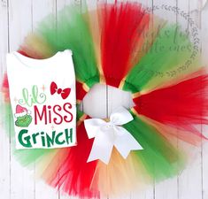 a red, green and white tutule with a t - shirt on it