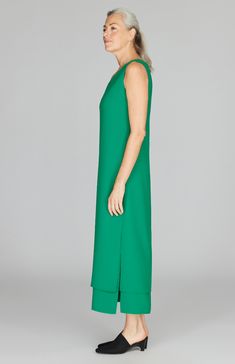 An effortless midi length dress with our signature double layer detailing. This dress features a flattering V neck, a back neckline keyhole, and side slits for movement. Elegant Green Midi Dress With Side Slits, Elegant Longline Midi Dress With Side Slits, Large Stone, Midi Length Dress, Crepe Fabric, Pant Shirt, Short Jacket, New Arrival Dress, Skirts For Sale