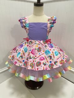 "Candyland Tutu Dress for a true Candy Queen. This is a 2 piece set, includes a semi customizable candy themed Pinafore dress with adjustable flutter sleeve straps and a removable tutu to add volume and an extra flair of sass! Tutus are made of Tulle and Ribbon with an elastic waistband. The tulle can be see thru and the skirts can be short. Tutus are only meant for decoration and are not meant to wear alone in many cases, pants/diaper covers/shorts are recommended to be worn underneath. Please Candyland Dress, Candy Theme Birthday, Christmas Dog Dress, Candy Queen, Sleeve Straps, Decora Harajuku, Cotton Candy Dress, Toddler Pageant, Pageant Wear