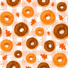 donuts and maple leaves on a checkered tablecloth seamless pattern, suitable for wallpaper or fabric