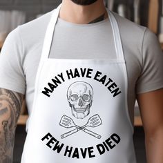 a man wearing an apron that says, many have eaten ten have died