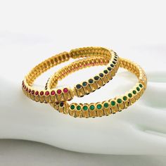 2.6 size Golden multicolor stone Bangles/Sabyasachi Bangles/American Diamond Ruby Bangles/CZ Indian wedding jewelry/Golden Indian Bangles Features Traditional Semi-Precious Colored stone bangles Set Handcrafted To Perfection Light Weight Perfect For Indian Weddings And Celebrations A Beautiful & Memorable Gift for Weddings and Special Occasions Available in 2.6 size The base metal color is Gold tone brass studded with colorful semi-precious stones on it. Facebook: www.facebook.com/Shoparyafa Sabyasachi Bangles, Stone Bangles, Ruby Bangles, Indian Bangles, Bangles Set, The Bangles, Bracelets Design, Bangles Indian, Stone Bangle