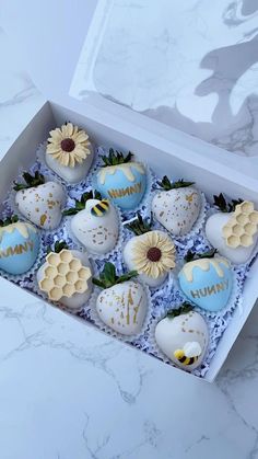 a box filled with chocolate covered strawberries and flowers