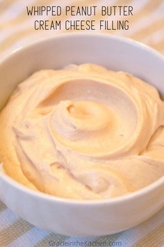 whipped peanut butter cream cheese filling in a white bowl on a checkered tablecloth