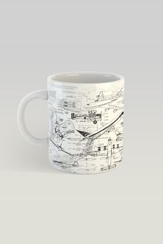 a coffee mug with an airplane diagram on it