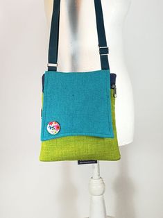 "This designed Canvas small bag is a great bag for daily use. It consists of a variety of fabric which makes it unique and beautiful. The bag is closed by a zipper and  Another  back pocket closed with a zipper, great safe storage of objects / Mobile Phone . The straps are soft and can be adjusted. on the bag a designed button that adds nice chiq to the bag  A perfect small zipper purse cross body bag for people who are minimalist.  --------------------------------------------------------------- Green Square Shoulder Bag With Cell Phone Pocket, Green Travel Pouch Phone Bag, Green Pouch Phone Bag For Travel, Green Bag With Cell Phone Pocket As Gift, Green Bag With Cell Phone Pocket For Gift, Green Crossbody Phone Bag With Removable Pouch, Green Crossbody Shoulder Bag With Cell Phone Pocket, Eco-friendly Green Crossbody Bag, Green Crossbody Phone Bag For Travel