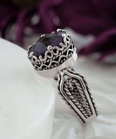 Looking for the perfect gift for your girlfriend, wife, mother, or sister? This gorgeous silver filigree art women's cocktail ring is the ideal choice. With its intricate details and beautiful face-up design, this ring is sure to stand out and make an impression. It features a double-sided, faceted checkerboard round-cut amethyst gemstone that measures 10mm and has a face size of 0.47 inches (12.00mm) in width. Not only is this ring stunning, but it also comes with a velvet pouch, silver polish Elegant Amethyst Birthstone Ring Gift, Spiritual Oval Ring With Intricate Design, Purple Promise Ring With Intricate Design, Spiritual Oval Rings With Intricate Design, Purple Intricate Design Promise Ring, Silver Filigree Open Ring, Sterling Silver Amethyst Promise Ring With Intricate Design, Formal Birthstone Ring With Round Stone, Elegant Formal Birthstone Ring With Stone Setting