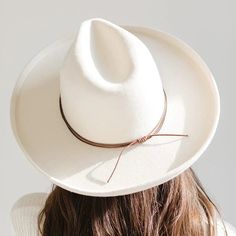 A hat band that is simple but stylish, the double strand rope band is the perfect minimal touch to take your hat style to the next level. Material - Waxed cotton Simply slide the band over the top of the crown of your hat to the point the crown touches the brim and then pull tails of band to tighten. Top Hats For Women, Gigi Pip, Hat Bands, Western Outfits Women, Feather Hat, Halo Style, Top Hats, Hat Style, Wearing A Hat