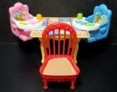 a toy table and chairs are set up for play with the children's toys