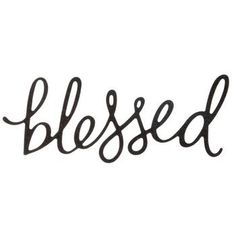 a black and white photo with the word,'blessed'written in cursive writing