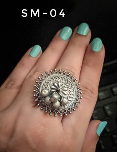 Add a hint of flamboyance to your outfit with these intricately designed and handcrafted rings in antique silver look .Rings are adjustable so can fit any size comfortably SM-01 & SM-02 diameter 2 inches Weight 15 GM's approx SM-03 ,SM-04 ,SM-05 ,SM-06 ,SM-07 Diameter 1 inches Weight 10 GM's approx Note: All in stock items will be shipped from New Delhi, India within 2-3 business days after receipt of payment. International orders may take anytime between 3 to 5weeks for your shipments to re Traditional Antique Silver Ring Jewelry, Traditional Antique Silver Ring, Handmade Traditional Antique Silver Ring, Traditional Handmade Antique Silver Rings, Silver Rings For Festive Gift Occasions, Festive Silver Temple Jewelry Rings, Handmade Temple Jewelry Ring For Festive Occasion, Handmade Festive Toe Ring, Festive Handmade Temple Jewelry Ring