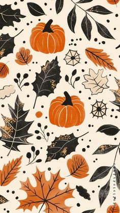 an orange, black and white fall pattern with leaves and acorns on it