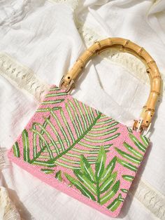 Beaded Palm Leaf Bag with Bamboo Handles  | Confête Summer Beaded Clutch Bag, Green Beaded Bag For Summer, Summer Green Beaded Bag, Summer Pink Beaded Bag, Elegant Pink Vacation Bag, Summer Pink Beaded Shoulder Bag, Pink Vacation Bag With Bamboo Handle, Pink Bag With Top Handle And Bamboo Detail, Pink Top Handle Bag With Bamboo Handle