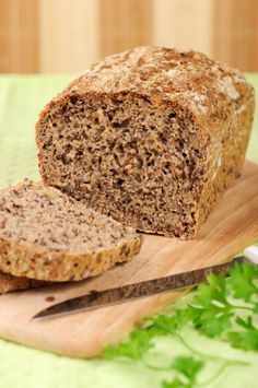 a loaf of banana bread sitting on top of a white plate